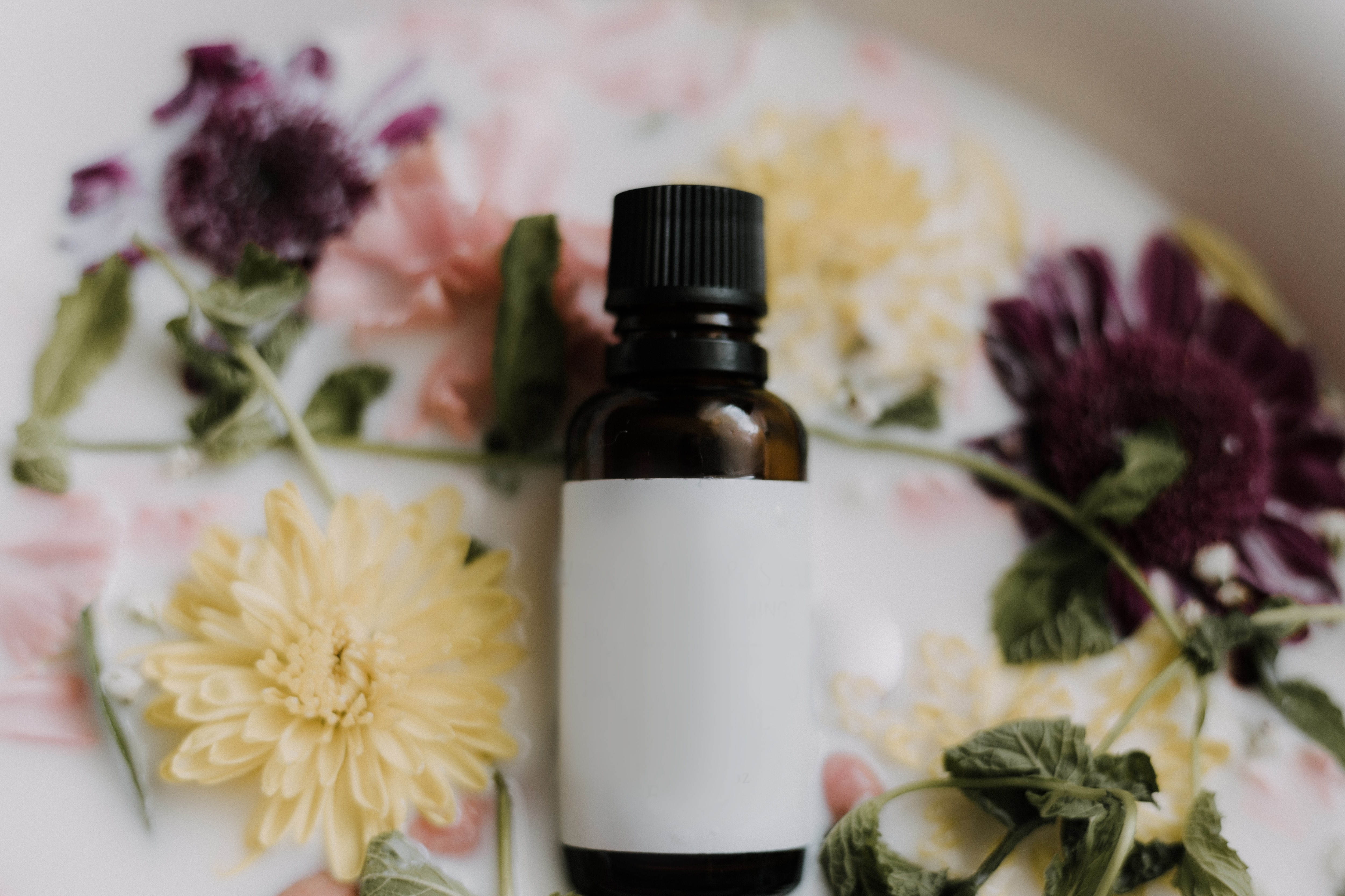 Essential oils on a floral background